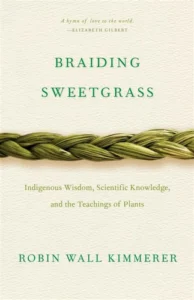 Front cover of Braiding Sweetgrass by Robin Wall Kimmerer.