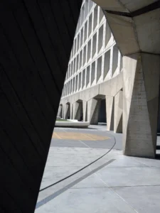The curved concrete front of the Robert C. Weaver Federal Building, headquarters of the U.S. Department of Housing and Urban Development in Washington, D.C. This is an illustration of where Ann Oliva worked for 10 years, not a photograph of her.